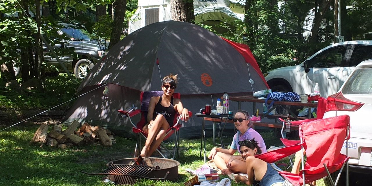 Family Camping Creates Lasting Memories at Sutton Falls Campground Family relaxing together at a campsite at Sutton Falls Campground in Massachusetts